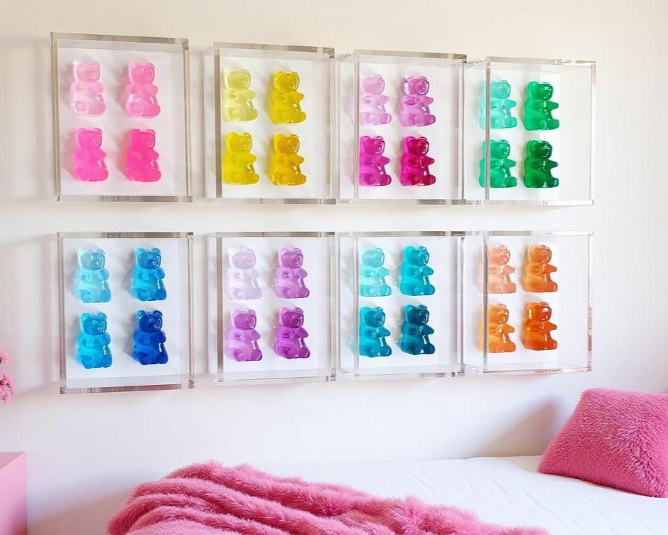 A radiant fusion of nostalgia and modern luxury, this jewel‑tone gummy bear sculpture is meticulously cast in premium resin and displayed within a museum‑grade, UV‑protected shadow box. Each bear glows with gemstone richness—deep sapphire, amethyst, ruby, citrine, or emerald tones—capturing light like a miniature piece of candy‑inspired fine art.