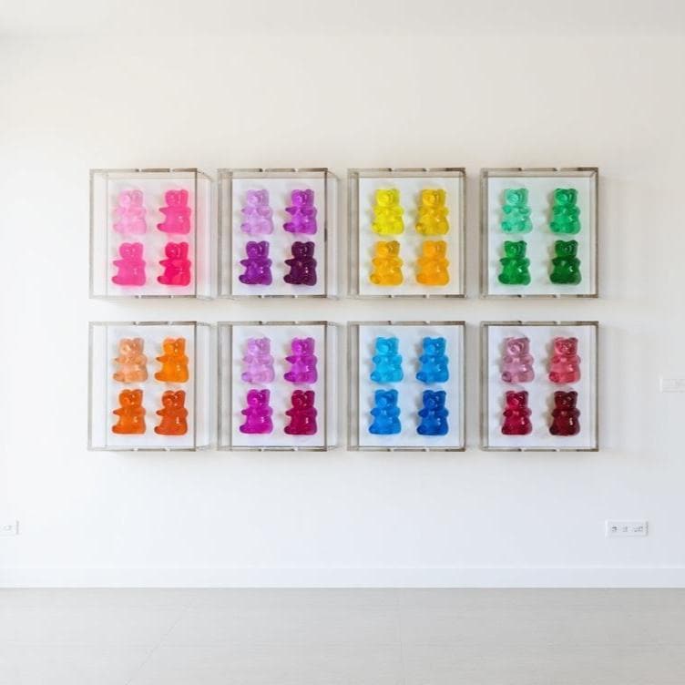 A radiant fusion of nostalgia and modern luxury, this jewel‑tone gummy bear sculpture is meticulously cast in premium resin and displayed within a museum‑grade, UV‑protected shadow box. Each bear glows with gemstone richness—deep sapphire, amethyst, ruby, citrine, or emerald tones—capturing light like a miniature piece of candy‑inspired fine art.