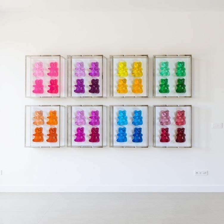 A radiant fusion of nostalgia and modern luxury, this jewel‑tone gummy bear sculpture is meticulously cast in premium resin and displayed within a museum‑grade, UV‑protected shadow box. Each bear glows with gemstone richness—deep sapphire, amethyst, ruby, citrine, or emerald tones—capturing light like a miniature piece of candy‑inspired fine art.
