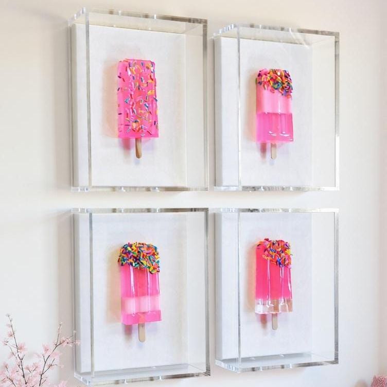 Luxurious Customizable Resin Popsicle Wall Art – Original Shadow Box Design
A playful icon meets high‑end artistry in this handcrafted pink resin popsicle, elegantly showcased inside a modern shadow box. This piece blends nostalgia with luxury, transforming a simple childhood treat into a bold, contemporary art statement.