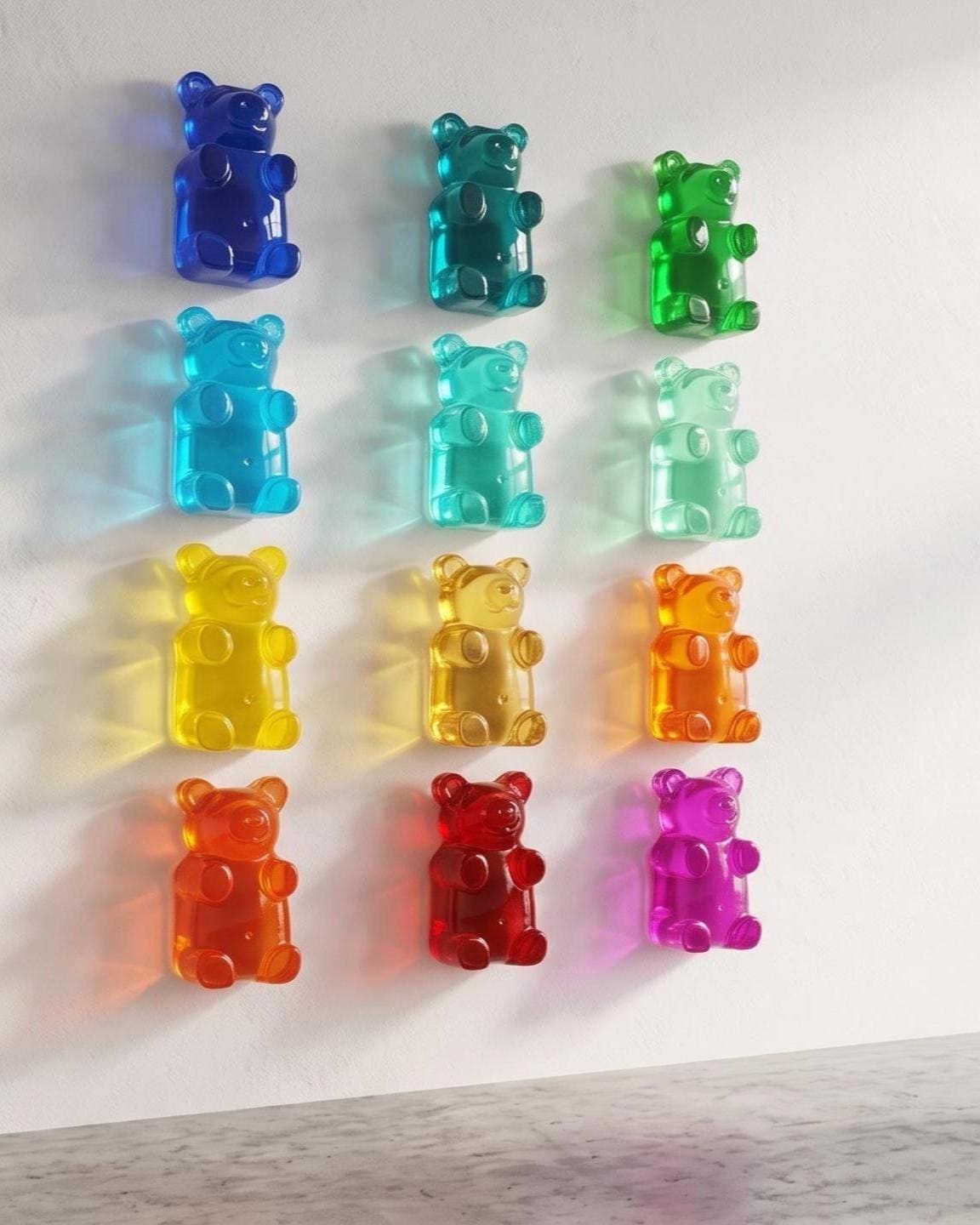 Giant 7 Inch Gummy Bear Wall Sculpture! Perfect for creating fun wall decor, this vibrant resin sculpture captures the adorable and iconic look of a gummy bear in a bold, eye-catching size. Whether you're decorating a kids' room, a playful gallery wall, or looking for a unique accent piece, this sculpture is sure to stand out.